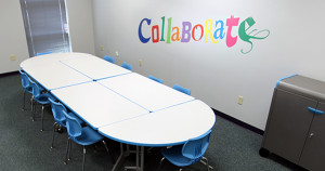 UXL Nest & Fold tables create a conference room area and move out of the way for other activities.
