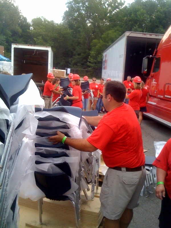 Volunteers unload Smith System® Flavors® Chairs